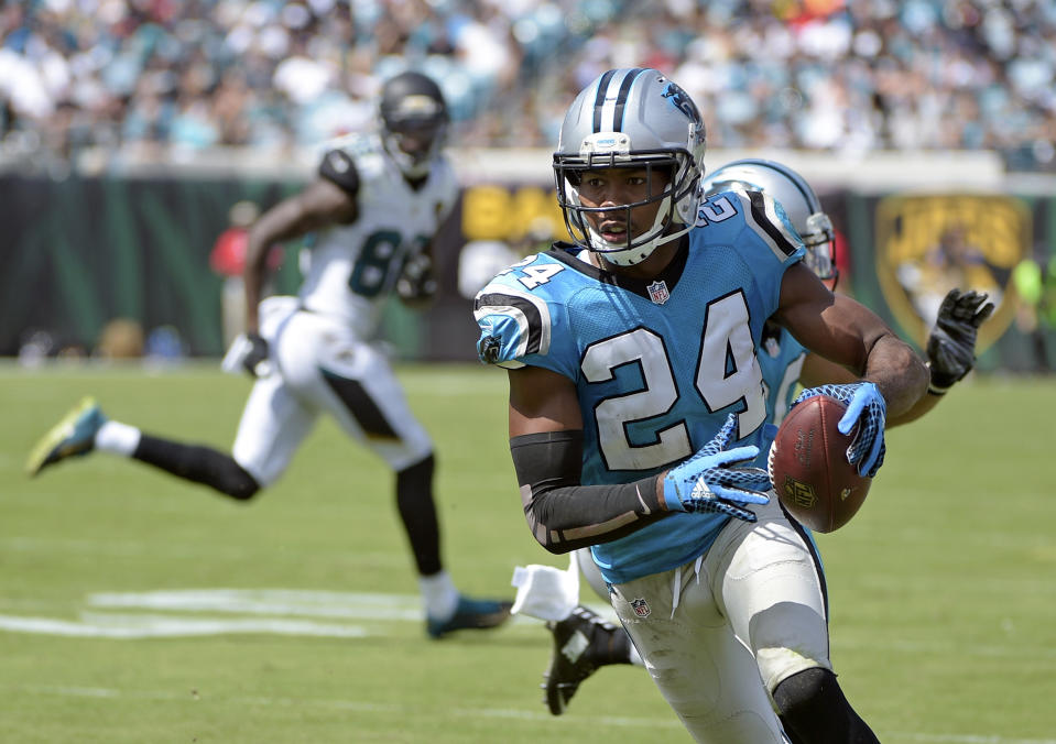 FILE - Carolina Panthers cornerback Josh Norman (24) runs back an interception against the Jacksonville Jaguars for a 30-yard touchdown during the second half of an NFL football game on Sept. 13, 2015, in Jacksonville, Fla. The Panthers worked out 35-year-old cornerback Norman on Monday, Dec. 26, 2022, because starter Jaycee Horn&#x002019;s status for Sunday&#x002019;s crucial game against the Tampa Bay Buccaneers is up in the air. (AP Photo/Phelan M. Ebenhack, File)