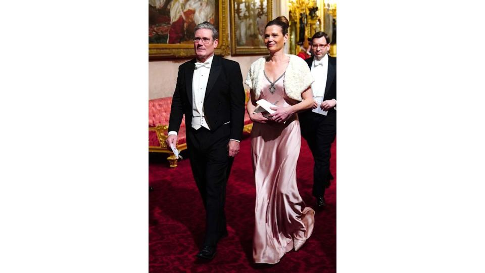 Keir Starmer in a tux with his wife Victoria in a pink silk dress