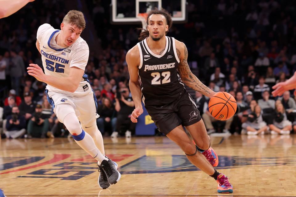 Providence guard Devin Carter drives to the basket against Creighton guard Baylor Scheierman during their Big East Tournament game on March 14. Carter announced Wednesday that he will enter the NBA Draft.