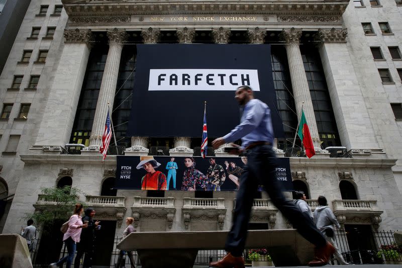 FILE PHOTO: FILE PHOTO: A banner to celebrate the IPO of online fashion house Farfetch is displayed on the facade of the of the NYSE in New York