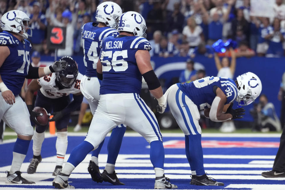 Indianapolis Colts running back Jonathan Taylor (28) celebrates his touchdown against the Chicago Bears during the second half of an NFL football game Sunday, Sept. 22, 2024, in Indianapolis. (AP Photo/Michael Conroy)