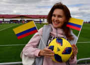 <p>A Colombia supporter cheers on her team during a training session in Kazan on June 14, 2018, ahead of the Russia 2018 World Cup football tournament. (Photo by LUIS ACOSTA / AFP) </p>