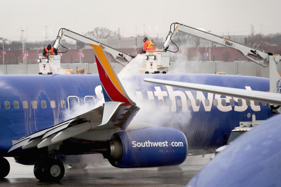 US: Workers deice a Southwest Airline aircraft at Midway Airport in Chicago (Getty Images)