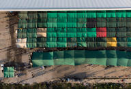 <p>Aerial view of tents at an abandoned bus station used as temporary shelter for Honduran migrants taking part in a caravan heading to the U.S., in Juchitan de Zaragoza, Oaxaca state, Mexico on Oct. 30, 2018. (Photo: Guillermo Arias/AFP/Getty Images) </p>