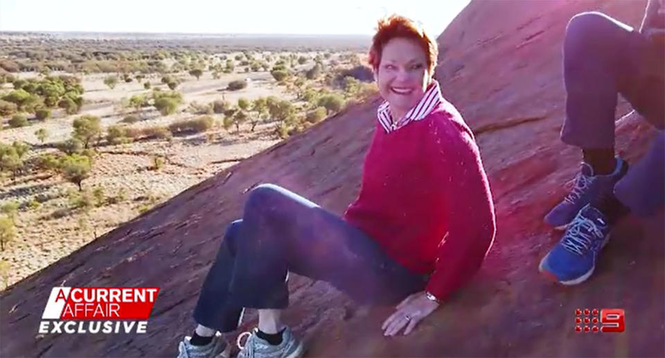 Senator Pauline Hanson only made it part way up Uluru when she felt too unsafe to keep climbing and was forced to come back down. Source: A Current Affair