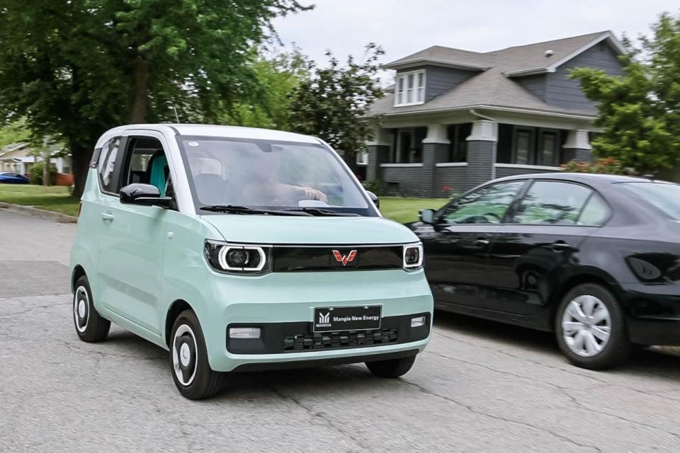 John Karlin drives his Hong Guang MINI EV Macaron, a mini car produced in China, on May 3 in Oklahoma City.