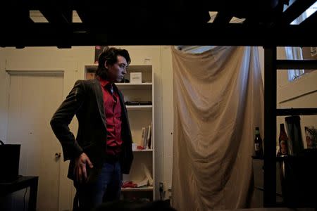 Zander Dejah, 25, a Virtual Reality engineer gets dressed in his room in San Francisco, California, U.S. February 4, 2017. REUTERS/Gabrielle Lurie