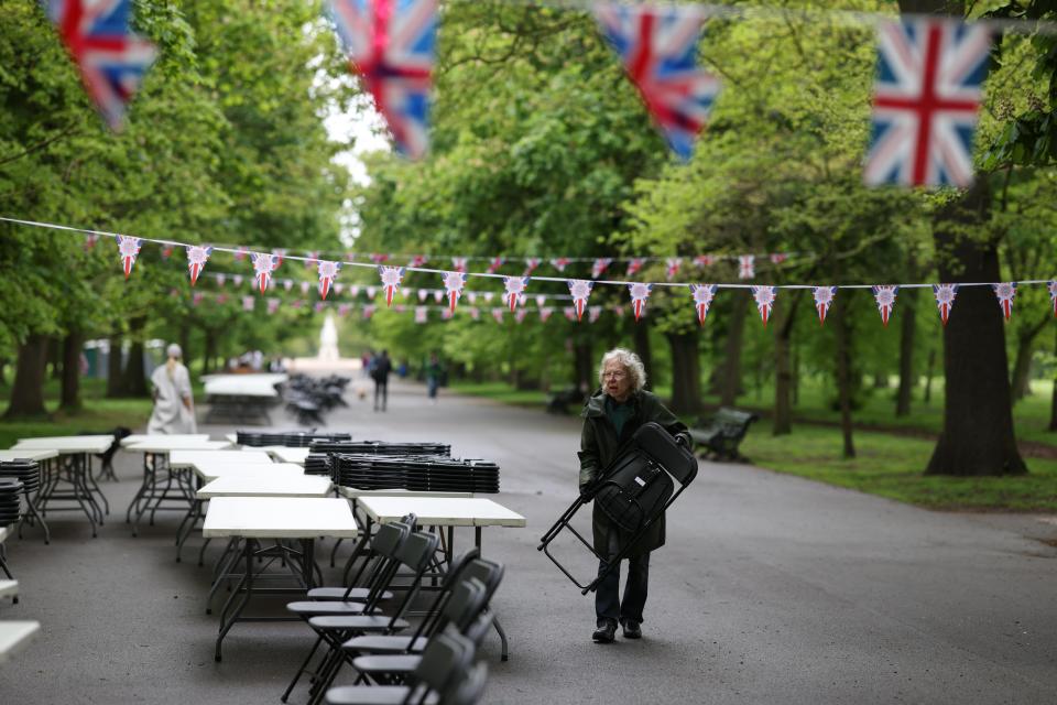 A volunteer from The Friends of Regent’s Park & Primrose Hill sets up tables and chairs (Getty Images)