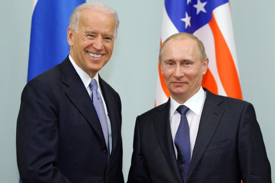 <p>Russian Prime Minister Vladimir Putin shakes hands with US Vice President Joe Biden during a meeting in Moscow (file picture 2011)</p> (POOL/AFP via Getty Images)