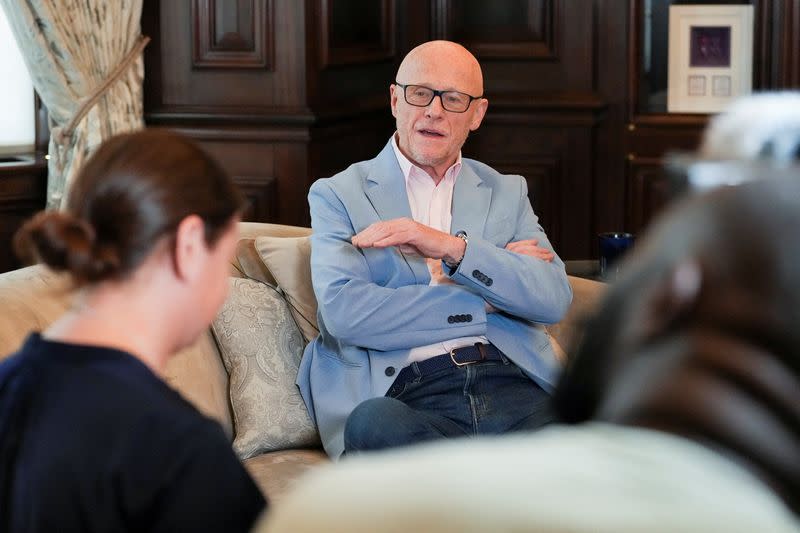 John Caudwell, the billionaire founder of retailer Phones4u, poses for a photograph during an interview with Reuters in London