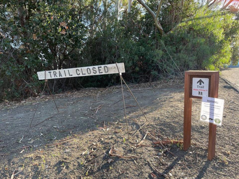 A barricade closes the Hill Street trail entrance to Cerro San Luis on Friday, Sept. 30, 2022, after multiple mountain lion sightings in the area.