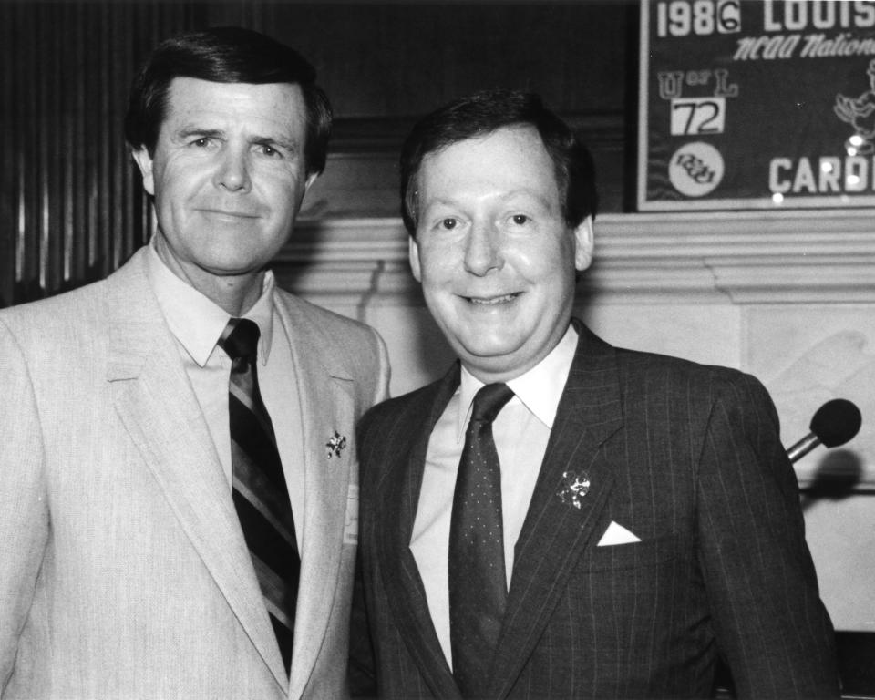 Louisville men's basketball Hall of Fame coach Denny Crum, left, poses for a picture with U.S. Sen. Mitch McConnell on Wednesday, April 16, 1986, in Washington D.C. after the Cardinals won their second NCAA title. Crum died at age 86 on Tuesday, May 9, 2023.