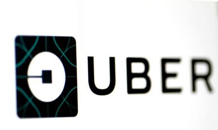 FILE PHOTO: The Uber logo is seen on a screen in Singapore August 4, 2017. REUTERS/Thomas White /File Photo