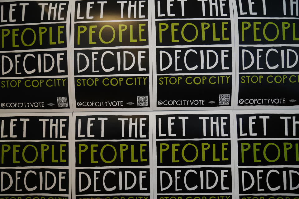 Signs are posted for the "Stop Cop City" movement at one of their headquarters, Thursday, July 20, 2023, in Atlanta. Activists with the Stop Cop City Vote Coalition are trying to get the signatures of more than 70,000 Atlanta residents by Aug. 14 to force a referendum allowing voters to decide the fate of a proposed police and firefighter training center. (AP Photo/Brynn Anderson)