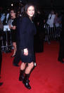 Golden Globe winner Catherine Zeta-Jones usually goes for heels and elegant gowns now. In 1997, she paired lace-up boots with a schoolgirl-style suit for one of her first red carpet appearances.