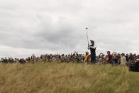 Tiger Woods of the US plays off the 6th tee during the first round of the British Open golf championship on the Old Course at St. Andrews, Scotland, Thursday July 14, 2022. The Open Championship returns to the home of golf on July 14-17, 2022, to celebrate the 150th edition of the sport's oldest championship, which dates to 1860 and was first played at St. Andrews in 1873. (AP Photo/Gerald Herbert)