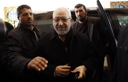 Rached Ghannouchi (C), leader of the Ennahda Party, arrives at a meeting in Tunis December 23, 2013. REUTERS/Zoubeir Souissi