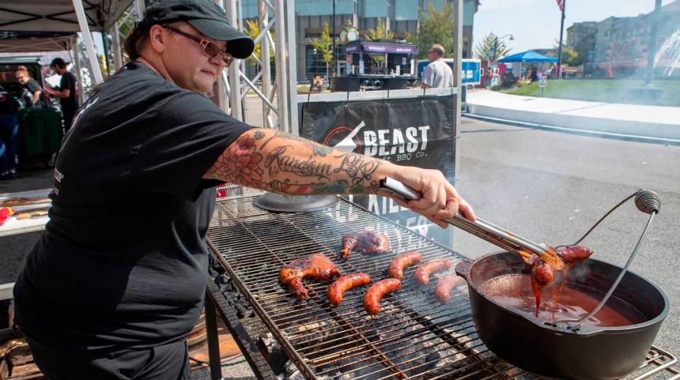 Loren Osequera, with Beast BBQ, prepares Stag Beer brats and smoked chicken leg quarters at last year’s Oktoberfest in Downtown Belleville. The 42nd annual Belleville Oktoberfest takes place Sept. 15-16, with food, live music, entertainment, games and beer.