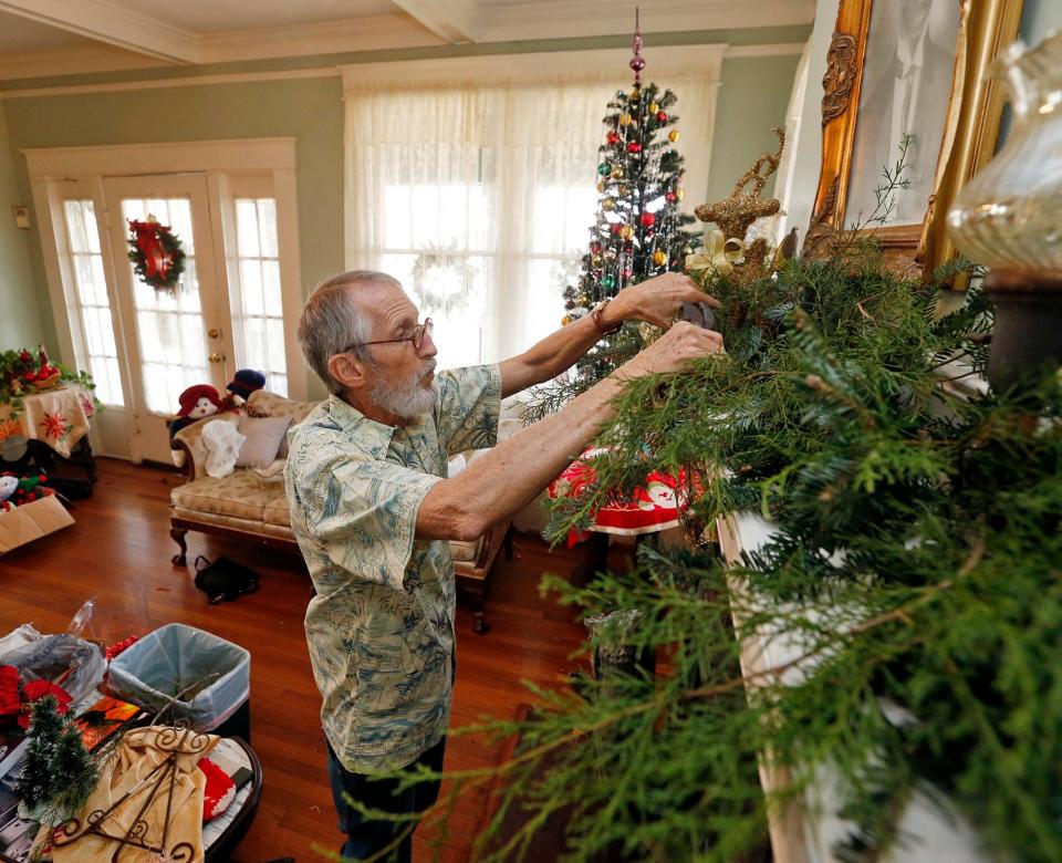 LaMar Merrill decorates inside the Murphy-Collins House, home of the Murphy African American Museum, on Paul W. Bryant Drive in Tuscaloosa for the annual Christmas open house in this 2014 photo. This year's open house will be from 2-5 p.m. Sunday.  [Staff file photo]