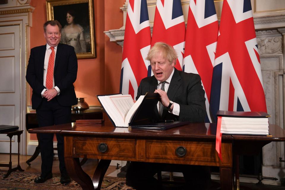 <p>Boris Johnson signs the Trade and Cooperation Agreement</p> (AP)