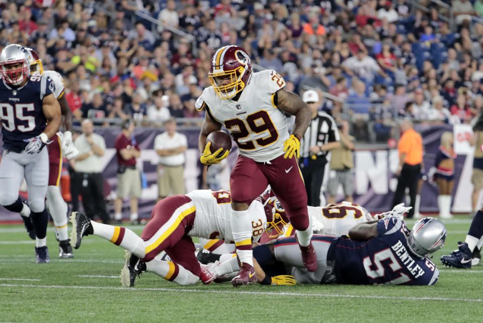 FOXBOROUGH, MA - AUGUST 09: Washington Redskins running back Derrius Guice (29) breaks through the line during a preseason NFL game between the New England Patriots and the Washington Redskins on August 9, 2018, at Gillette Stadium in Foxborough, Massachusetts. The Patriots defeated the Redskins 26-17. (Photo by Fred Kfoury III/Icon Sportswire via Getty Images)