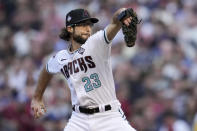 Arizona Diamondbacks starting pitcher Zac Gallen throws against the Texas Rangers during the first inning in Game 5 of the baseball World Series Wednesday, Nov. 1, 2023, in Phoenix. (AP Photo/Godofredo A. Vásquez)