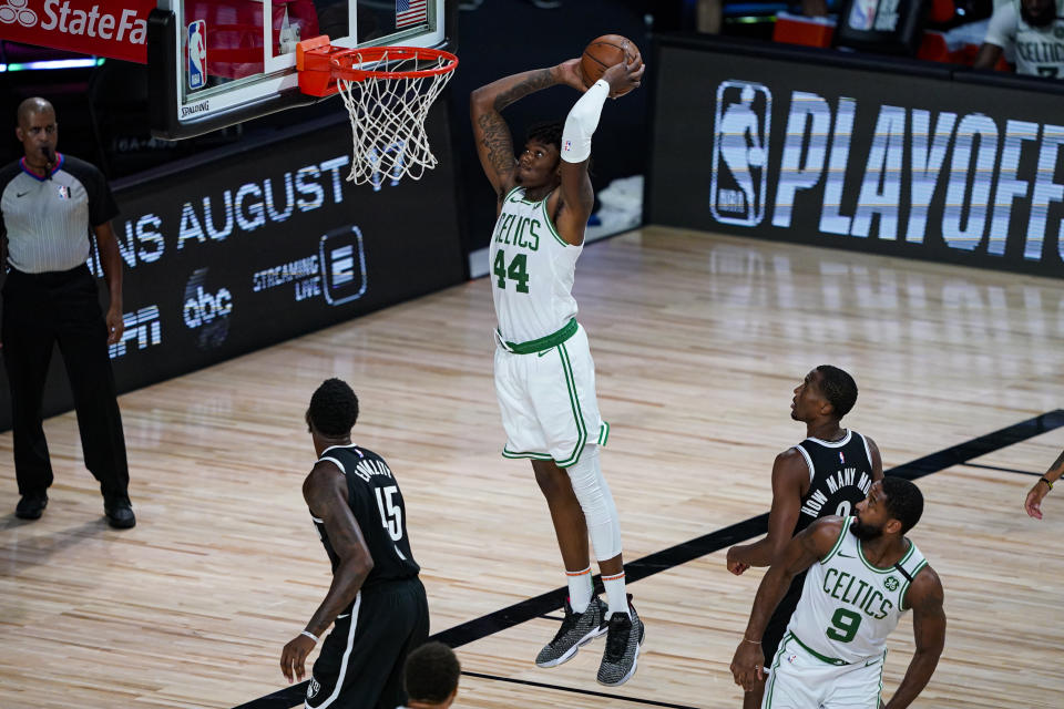 Boston Celtics center Robert Williams III (44) gets a dunk against the Brooklyn Nets during the second half of an NBA basketball game Wednesday, Aug. 5, 2020 in Lake Buena Vista, Fla. (AP Photo/Ashley Landis)