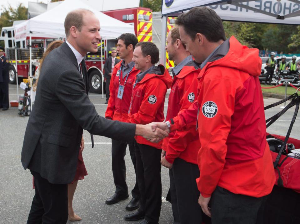 The Duke of Cambridge meets with first responders during a visit to the Kitsilano Coast Guard station, in Vancouver on Sunday, September 25, 2016. THE CANADIAN PRESS/Darryl Dyck