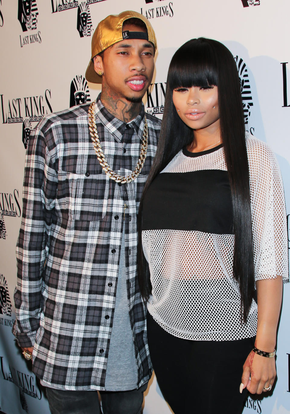 LOS ANGELES, CA - FEBRUARY 20:  Rapper Tyga (L) and Model Blac Chyna (R) attend the press preview at Tyga's "Last Kings" flagship store on February 20, 2014 in Los Angeles, California.  (Photo by Paul Archuleta/FilmMagic)