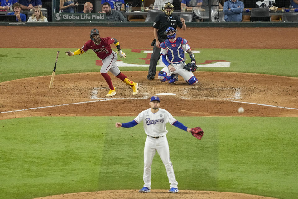 CORRECTS TO DOUBLE, INSTEAD OF SINGLE - Arizona Diamondbacks' Ketel Marte watch his double off Texas Rangers starting pitcher Nathan Eovaldi during the fifth inning in Game 1 of the baseball World Series, Friday, Oct. 27, 2023, in Arlington, Texas. (AP Photo/Tony Gutierrez)