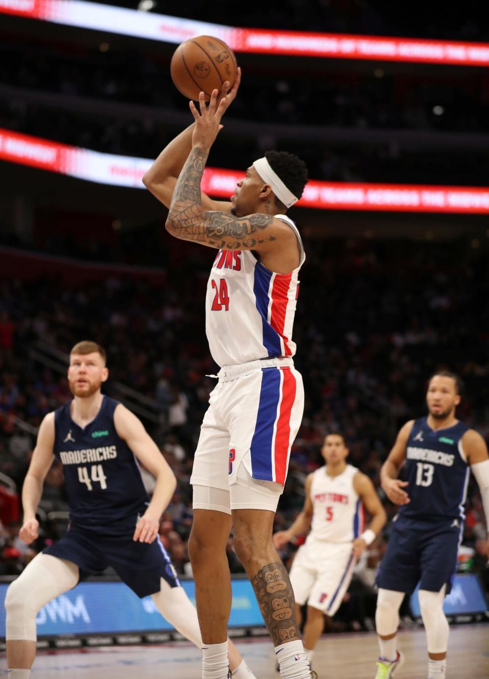 Detroit Pistons forward Jamorko Pickett scores against the Dallas Mavericks during the second quarter Wednesday, April 6, 2022, at Little Caesars Arena.