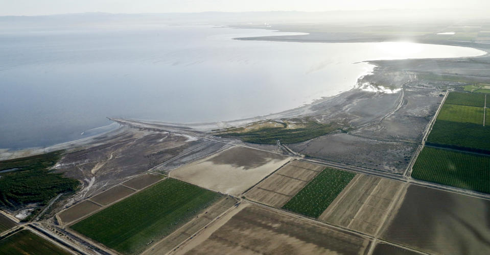FILE - This May 1, 2015 file photo shows the exposed lake bed of the Salton Sea drying out near Niland, Calif. Work on a multistate plan to address drought on the Colorado River in the U.S. West won't be done to meet a Monday, March 4, 2019 federal deadline. A California irrigation district with the highest-priority rights to the river water says it won't approve the plan without securing money to restore the state's largest lake. The Imperial Irrigation District wants $200 million for the Salton Sea, a massive, briny lake in the desert southeast of Los Angeles. (AP Photo/Gregory Bull, File)
