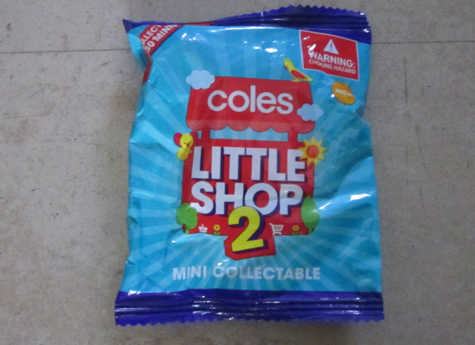 A Coles Little Shop 2 collectable in its plastic wrapping. Someone's selling this one on eBay for $150 claiming it's the rare golden trolley. Coles only releases 100 of them a week.