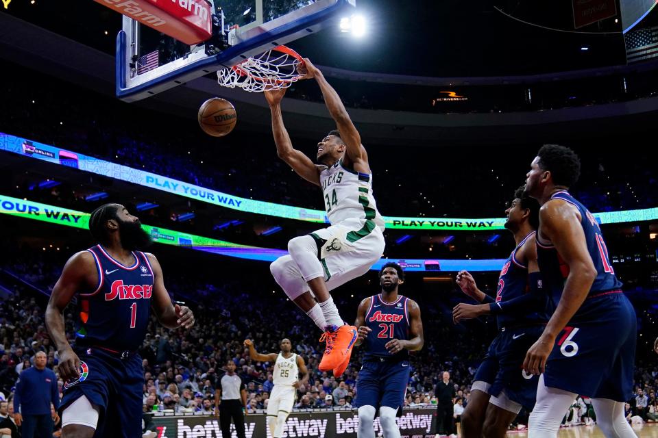 Milwaukee Bucks' Giannis Antetokounmpo dunks the ball during the first half of an NBA basketball game against the Philadelphia 76ers, Tuesday, March 29, 2022, in Philadelphia. (AP Photo/Matt Slocum)