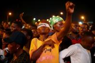 A demonstrator wearing a blindfold with an inscription "End Sars", gestures during protest against alleged police brutality in Lagos