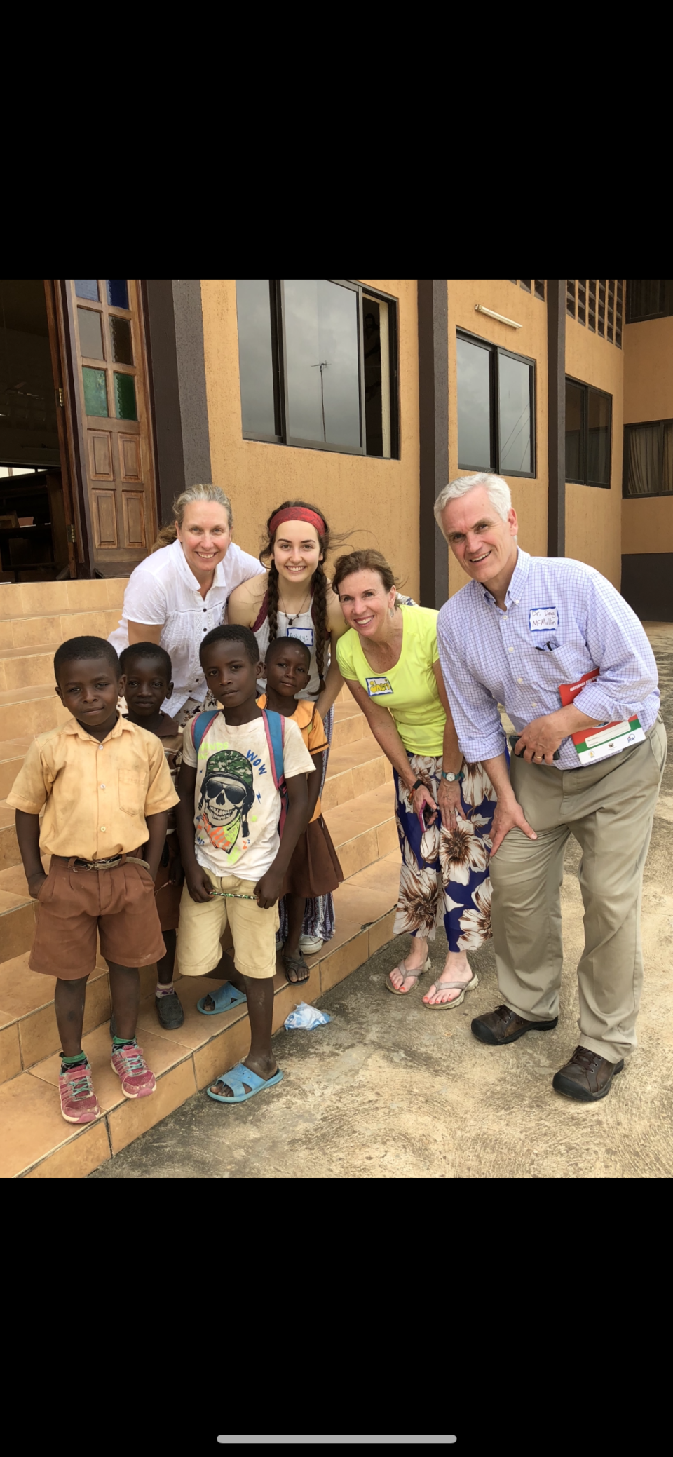 Dr. Debra Lupeika, left, with children and other medical staff during a medical mission in Ghana with Dr. McMullin