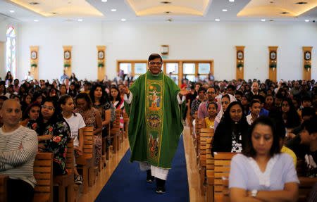 The expat bishop walks between the worshippers during the mass at St. Francis of Assisi Catholic Church in Jebel Ali, as Catholics are awaiting a historical visit by Pope Francis to the United Arab Emirates, in Dubai, UAE January 18, 2019. REUTERS/Ahmed Jadallah