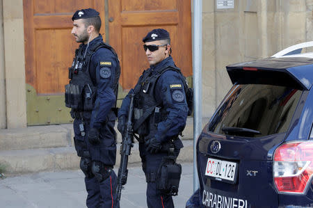 Armed police officers stand on duty ahead of a speech by Britain's Prime Minister Theresa May in Florence, Italy September 22, 2017. REUTERS/Max Rossi