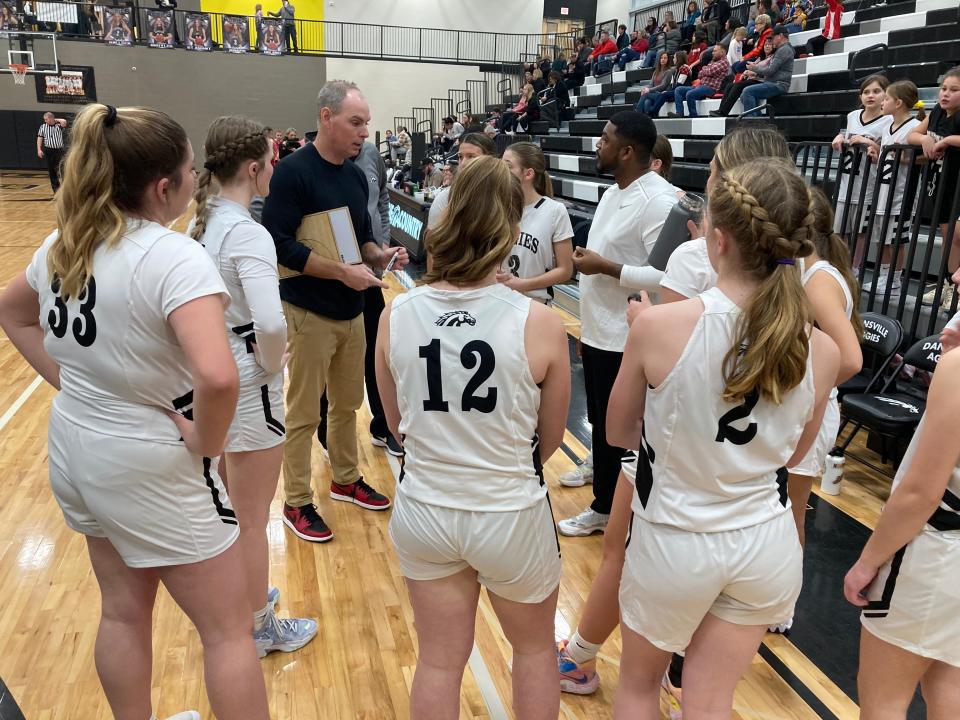 The Dansville girls basketball team gets instructions from coach Mike Sykes during a break in play in a CMAC contest against Laingsburg on Friday, January 13, 2023, at Dansville High School. Dansville is off to a 9-1 start and is ranked No. 1 in Division 3 in the latest Associated Press poll.