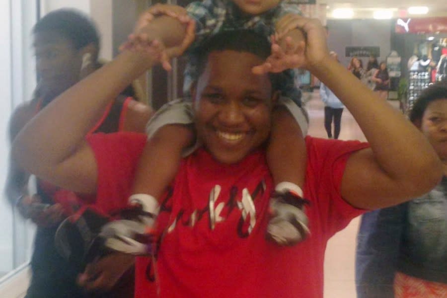 This 2016-2017 family photo shows Samuel Celestin of Ocoee, Fla., with his baby nephew. Celestin, the son of a lawyer and a doctor, immigrated to Miami from Haiti with his family when he was young. The youngest of four, he stood out early — sixth-grade class president, captain of the basketball team. He had a soft spot for those less fortunate, his family said, once giving his bus fare to a homeless man even though it meant walking home from the movies when he was a teenager. (Courtesy Joanne Celestin via AP)