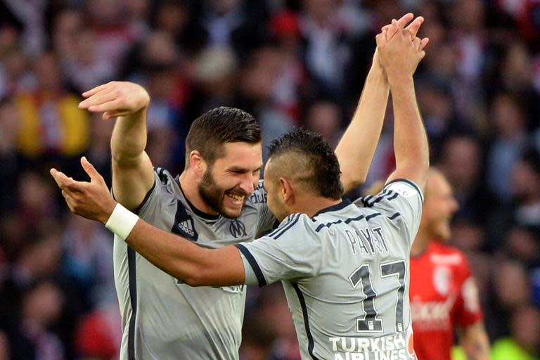 Marseille's Andre-Pierre Gignac (L) is congratulated by Dimitri Payet after scoring during the French Ligue 1 match against Lille on May 16, 2015 at the Pierre Mauroy stadium in Lille