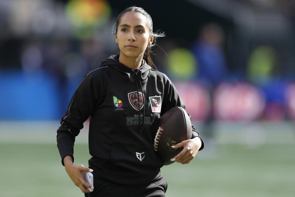 FILE - Team Mexico Women's Flag quarterback Diana Flores looks on before an NFL football game between the Green Bay Packers and the New York Giants at Tottenham Hotspur Stadium in London, Sunday, Oct. 9, 2022. The New York Giants won 27-22. (AP Photo/Steve Luciano, File)