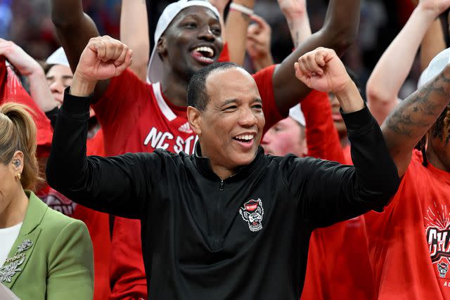 <p>Greg Fiume/Getty</p> Kevin Keatts cheering for the NC State Wolfpack