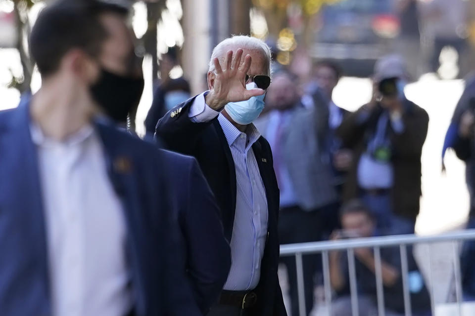 Democratic presidential candidate former Vice President Joe Biden waves as he arrives at the Queen theatre for meetings, Thursday, Nov. 5, 2020, in Wilmington, Del. (AP Photo/Carolyn Kaster)
