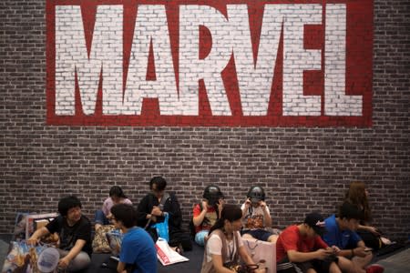 Visitors sit under a Marvel sign at the China International Cartoon and Game (CCG) Expo in Shanghai