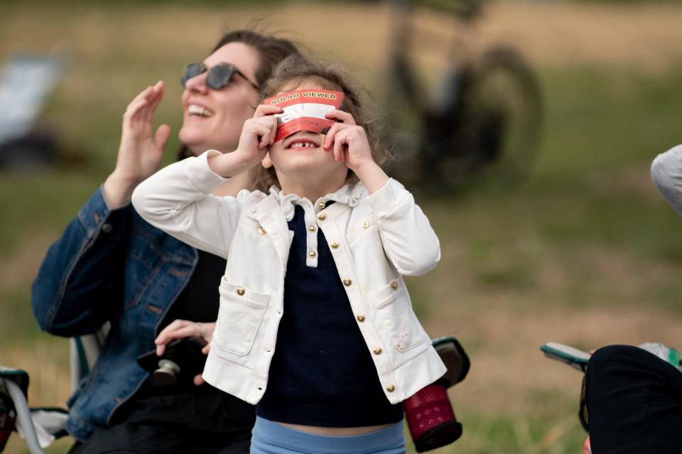 Coco Opris, 5, of Washington Crossing, views the solar eclipse, on April 8, 2024, at Washington Crossing Historic Park in Upper Makefield.