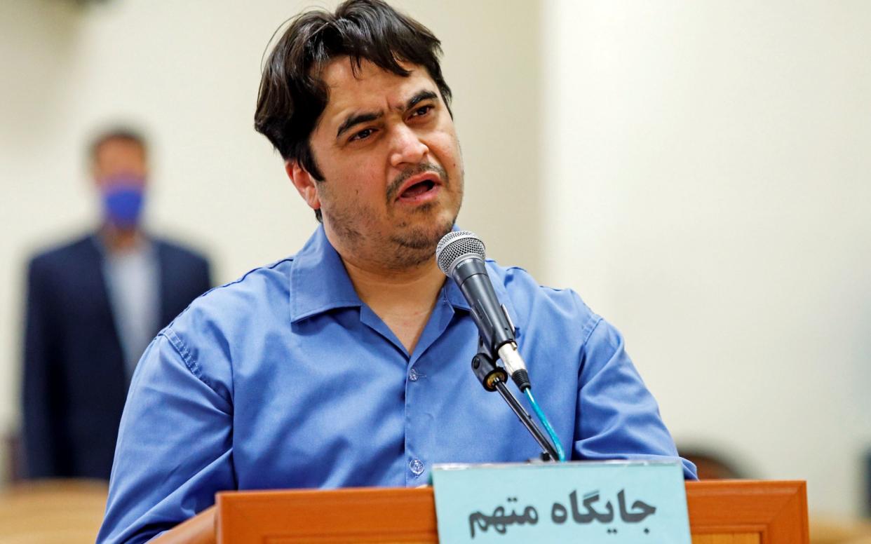 Ruhollah Zam speaks at his trial in Tehran - Reuters