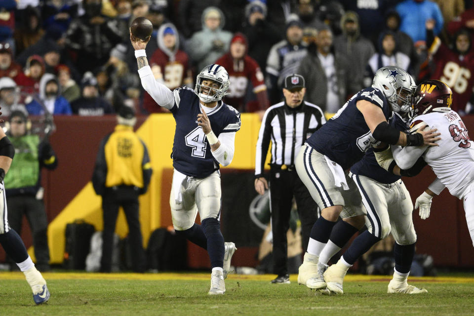 Dallas Cowboys quarterback Dak Prescott (4) throwing the ball downfield during the second half an NFL football game against the Washington Commanders, Sunday, Jan. 8, 2023, in Landover, Md. (AP Photo/Nick Wass)