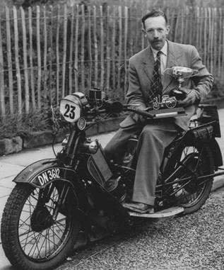 Captain Tom Moore on his beloved 1912 Scott Flying Squirrel