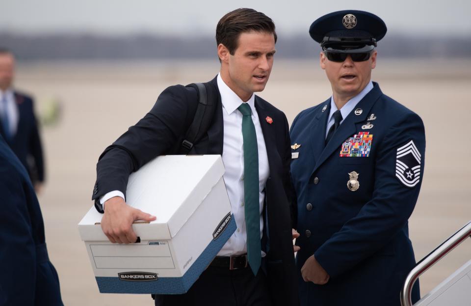 White House staffer John McEntee walks to board Air Force One prior to departure with US President Donald Trump from Joint Base Andrews in Maryland, January 23, 2020, as he travels to speak at the Republican National Committee Winter Meeting in Miami, Florida.